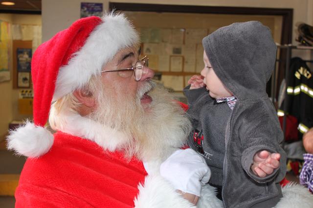 Children's Christmas Party at 8-100. 12-9-2012. Santa pays a visit . Photo by Vincent P. Tuzzolino